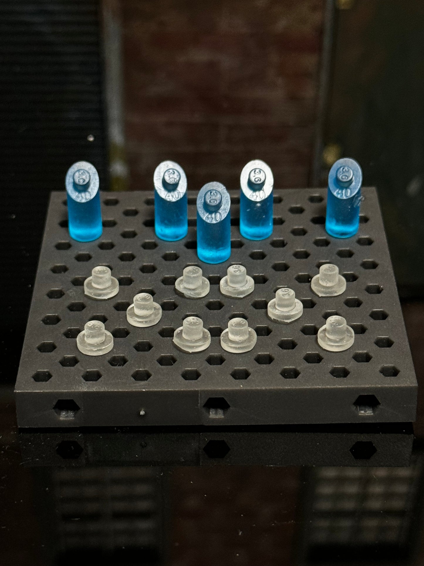Figure stand pegs compatible with the Ultimate Weapons Rack