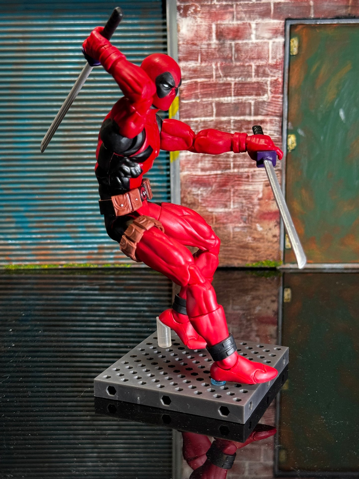 Figure stand pegs compatible with the Ultimate Weapons Rack